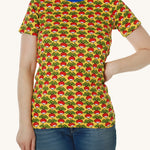 A bright yellow fabric with a repeat radish print, and a blue piping neck detail