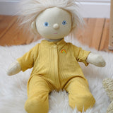 Olli Ella Dinkum Doll wearing a honey yellow pointelle PJ set with vest, pants, and babygrow, available to buy at Babipur.