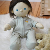 Olli Ella Dinkum Doll wearing a light green sage pointelle PJ set with vest, pants, and babygrow, sold at Babipur.