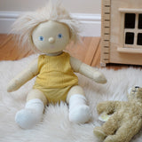 Dinkum Doll from Olli Ella dressed in a vest and pants from the honey yellow pointelle PJ set, it also comes with a matching babygrow - buy now at Babipur. 
