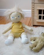 Dinkum Doll from Olli Ella dressed in a vest and pants from the honey yellow pointelle PJ set, it also comes with a matching babygrow - buy now at Babipur. 
