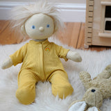 Olli Ella Dinkum Doll wearing a honey yellow pointelle PJ set - comes with a vest, pants and matching romper - sold at Babipur.