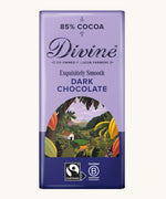 Front of Divine fairtrade smooth dark chocolate bar in purple wrapping with a cocoa farm illustration 