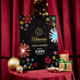 Divine fairtrade milk chocolate advent calendar available at Babipur. Showing the front of the calendar. Calendar is displayed with festive decorations.