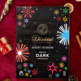 A flatlay with the Divine fairtrade dark chocolate advent calendar laid next to festive decorations. Calendar available at Babipur  