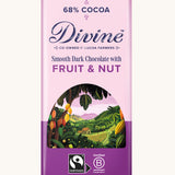 Front of Divine fairtrade smooth dark chocolate bar with fruit and nut in light purple wrapping with a cocoa farm illustration 