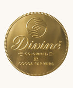 Divine fairtrade giant milk chocolate coin available at Babipur wrapped in gold foil with branding on the front. 