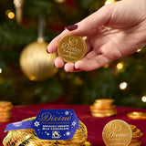 A adult hand holding one coin from the Divine fairtrade milk chocolate bag available at Babipur showing the scale of one coin.