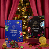 Divine fairtrade milk and dark chocolate advent calendars. Both calendars standing in a festive display with different Divine chocolate coins  available at Babipur