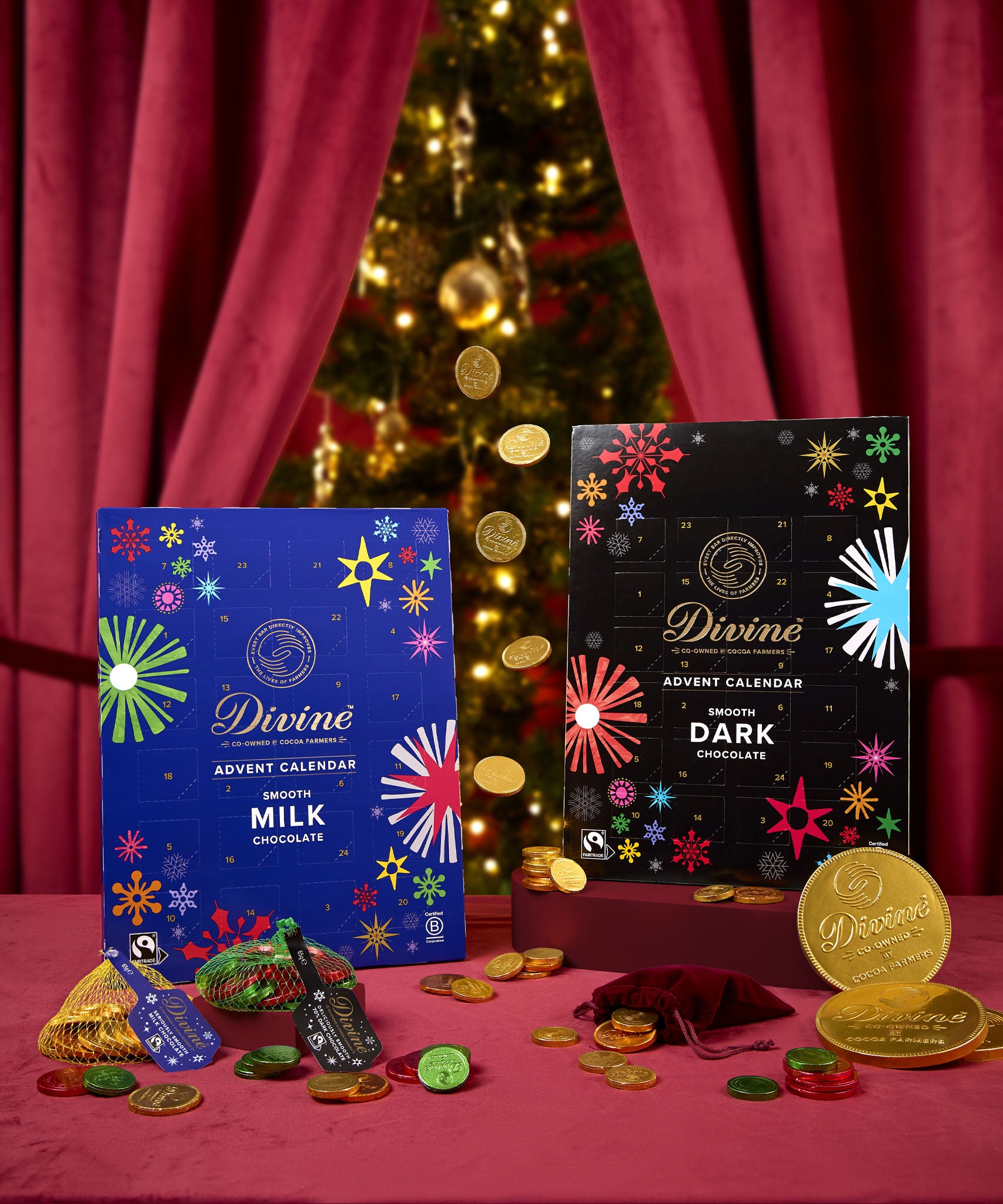 Divine fairtrade milk and dark chocolate advent calendars. Both calendars standing in a festive display with different Divine chocolate coins  available at Babipur