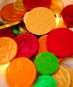 A mix of milk and dark Divine fairtrade chocolate coins available at Babipur.