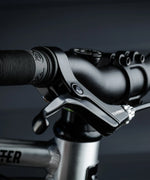 Close up of the brake and black rubber handle on the Early Rider auto belter bike