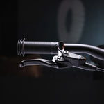 A closer look at the handle bar grips and break levers on the Early Rider Seeker X16 16" Bike - Brushed Aluminium