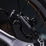 A closer look at the wheel of the Early Rider Seeker X16 16" Bike - Brushed Aluminium