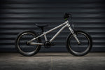 Early Rider Belter 16 inch wheel children's bike shown with Garage door background