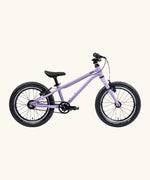Side of Early Rider's 16 inch belter auto bike in pale purple aluminium frame with black handle bars, seat and chunky wheels. 