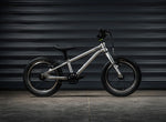 Early Rider Belter 14 inch wheel children's bike shown with Garage door background