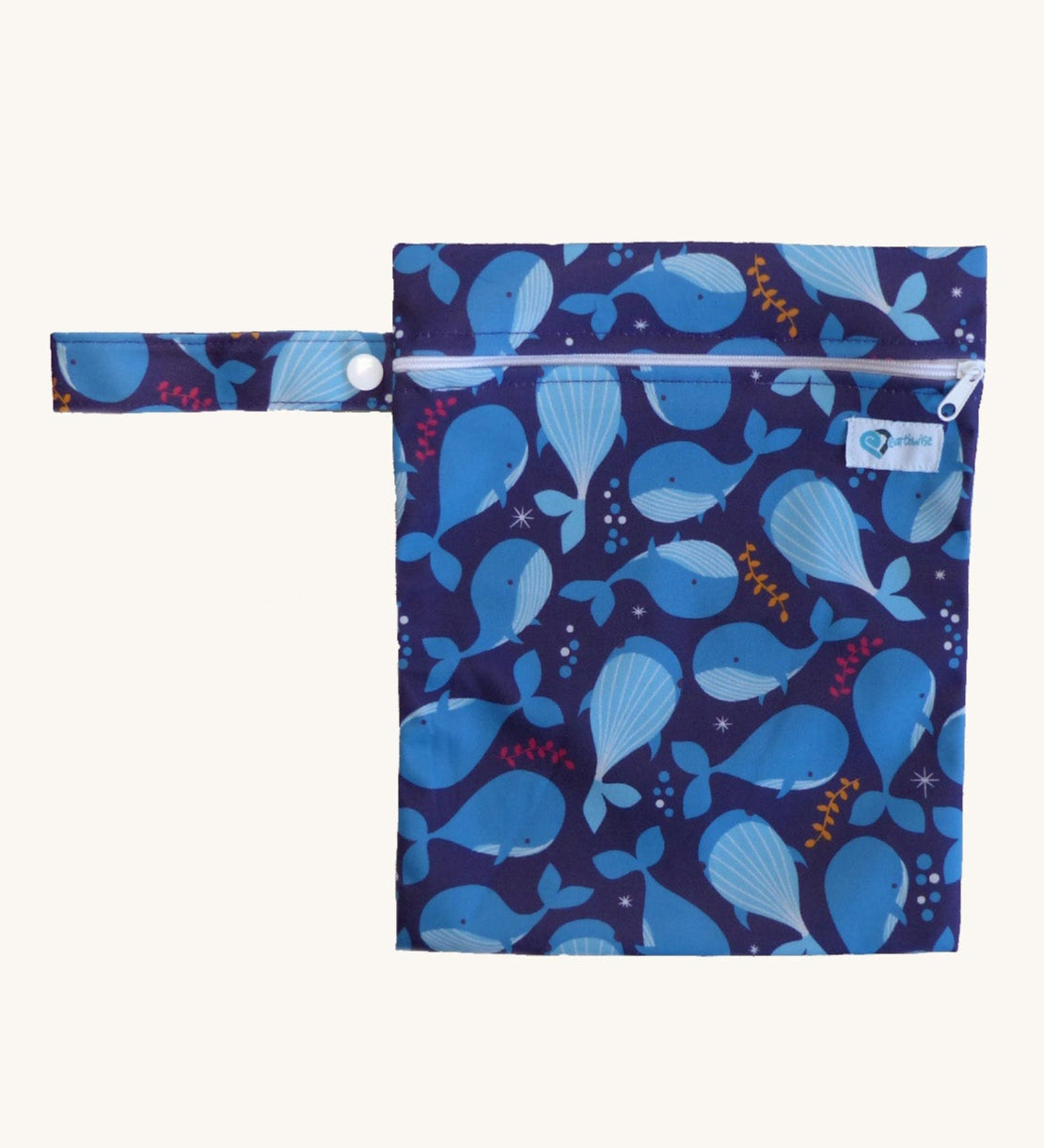 Earthwise medium wet bag in a whale design available at Babipur. A dark blue wetbag with a playful whale design. Features a white zip fastener and matching blue whale hanging loop.