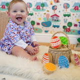 Rainbow Easter Eggs by Lanka Kade, made from wood, in a basket in the Babipur playroom, played with by baby.
