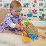 Lanka Kade Rainbow Easter Eggs, made from wood, in a basket in the Babipur playroom, played with by baby.