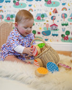 Lanka Kade Rainbow Easter Eggs, made from wood, in a basket in the Babipur playroom, played with by baby.