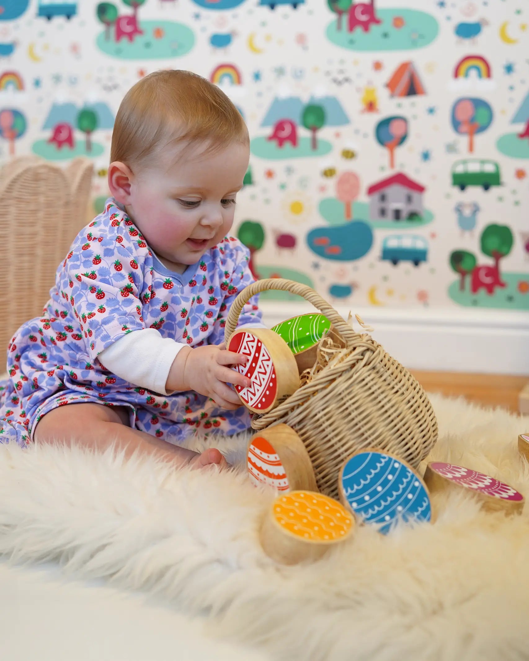 Lanka Kade Rainbow Easter Eggs, made from wood, in a basket in the Babipur playroom, played with by baby.