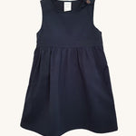 The Eco Outfitters organic and fair trade cotton school pinafore dress in navy.