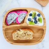 Bamboo baby section plate with banana loaf, dragonfruit slices and yogurt with fresh fruit and berries. 