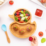 Eco Rascals Duck Bamboo Suction Plate, with fresh fruit and savory buns, and a tomato sauce. 