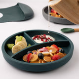 Eco Rascals Silicone Baby Plate in silver with removable divider, someone is pouring milk onto cereal and fruit.  