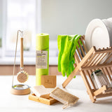 Ecoliving loofah kitchen sponge scrubber available at Babipur in a kitchen setting next to other Ecoliving kitchen items such as the wooden dish drainer.