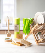 Ecoliving loofah kitchen sponge scrubber available at Babipur in a kitchen setting next to other Ecoliving kitchen items such as the wooden dish drainer.