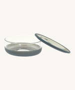 Elephant Box medium lunch bowl available at Babipur with the removable lid leaning on the bowl . 