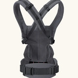 Back of Ergobaby omni 360 baby carrier in charcoal grey showing crossable straps configuration