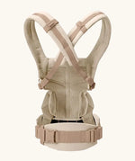 Back of Ergobaby omni 360 baby carrier in natural beige showing crossable straps configuration