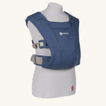 The Ergobaby Soft & Snug knit newborn baby carrier in a soft navy colour, from a side angle view.