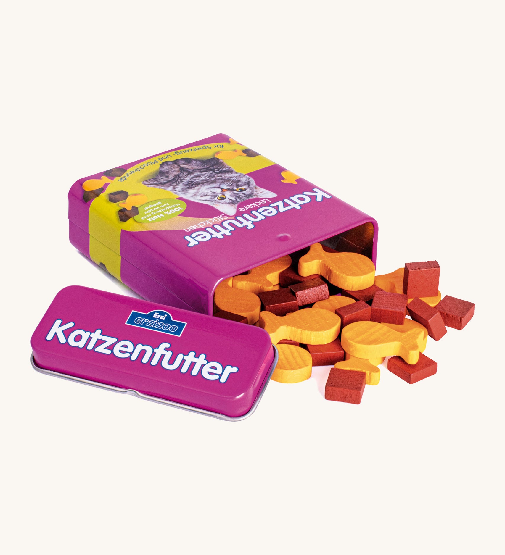 A open purple Erzi cat food tin lying flat next to the lid with the different shaped cat food wooden pieces pouring out of the tin.