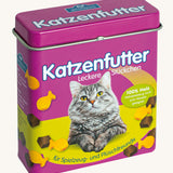 Front of the purple Erzi cat food tin with the lid on top showing a image of a cat surrounded by different shaped cat food pieces