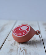 Erzi Gammon joint Wooden Play Food placed on a wooden surface. 