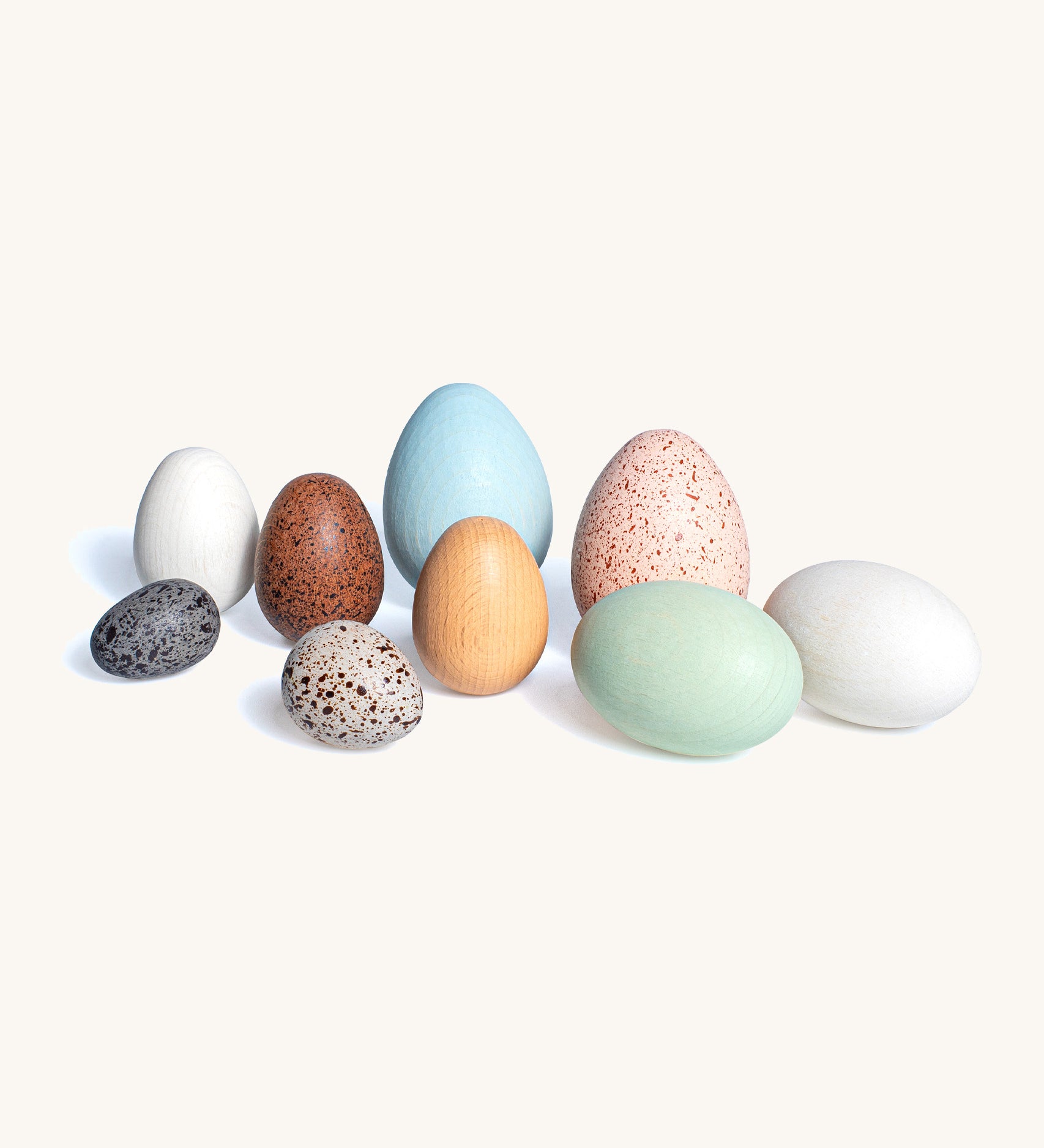 Erzi dozen realistic wooden toy bird eggs in a mix of pastel colours and speckled design
