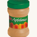 Erzi Wooden Apple Sauce jar, with a green lid and apple label. On a cream background. Perfect for playing cafe or shop