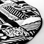 A closer look at the detailed monochromatic, black and white shapes on the Etta Loves x Camille Walala Reversible Playmat