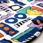 A closer look at the colourful print and shapes on the Etta Loves x Camille Walala Reversible Playmat
