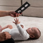 A parent playing with their child, using the Etta Loves Sensory Positive Affirmation Flash Cards