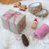 Christmas gift wrapped with Everlasto Beautiful Baker’s Twine in Beefeater Red, a red-and-white striped cotton twine, approx. 100m, ideal for Christmas wrapping and crafts - buy now at Babipur.