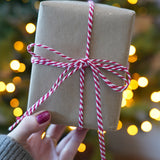 Close-up of tied with Beefeater Red baker’s twine from Everlasto, showing the red and white cotton strands twisted together, used for festive gift tags and wrapping - buy now at Babipur.