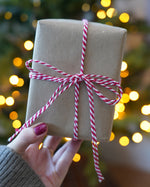 Close-up of tied with Beefeater Red baker’s twine from Everlasto, showing the red and white cotton strands twisted together, used for festive gift tags and wrapping - buy now at Babipur.