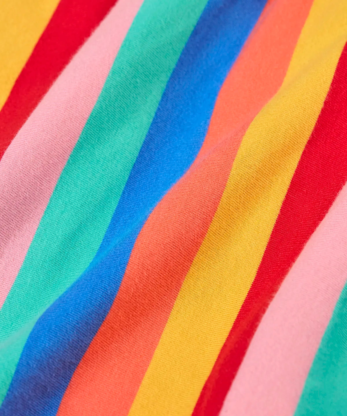 Close up of the rainbow stripe design on the Frugi Alba skort 