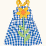 Frugi 100% organic cotton dress in blue and white gingham with a large sunflower patch on front and yellow shoulder straps