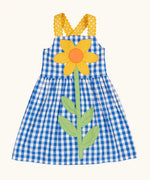 Frugi 100% organic cotton dress in blue and white gingham with a large sunflower patch on front and yellow shoulder straps
